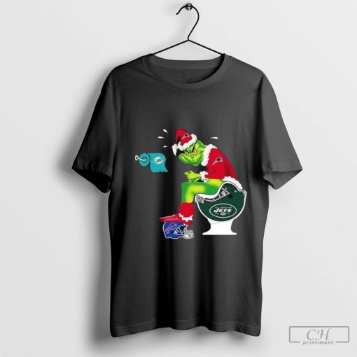 The Grinch Sitting On A Toilet Wearing A New England Patriot Toilet Miami Dolphins New York Jets Christmas T-Shirt