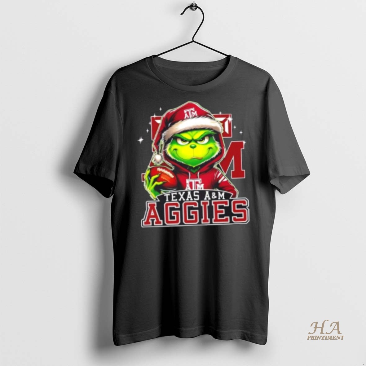 Official Grinch Is Holding A Ball And Smiling At Texas Am Aggies Fans Christmas Shirt Hoodie